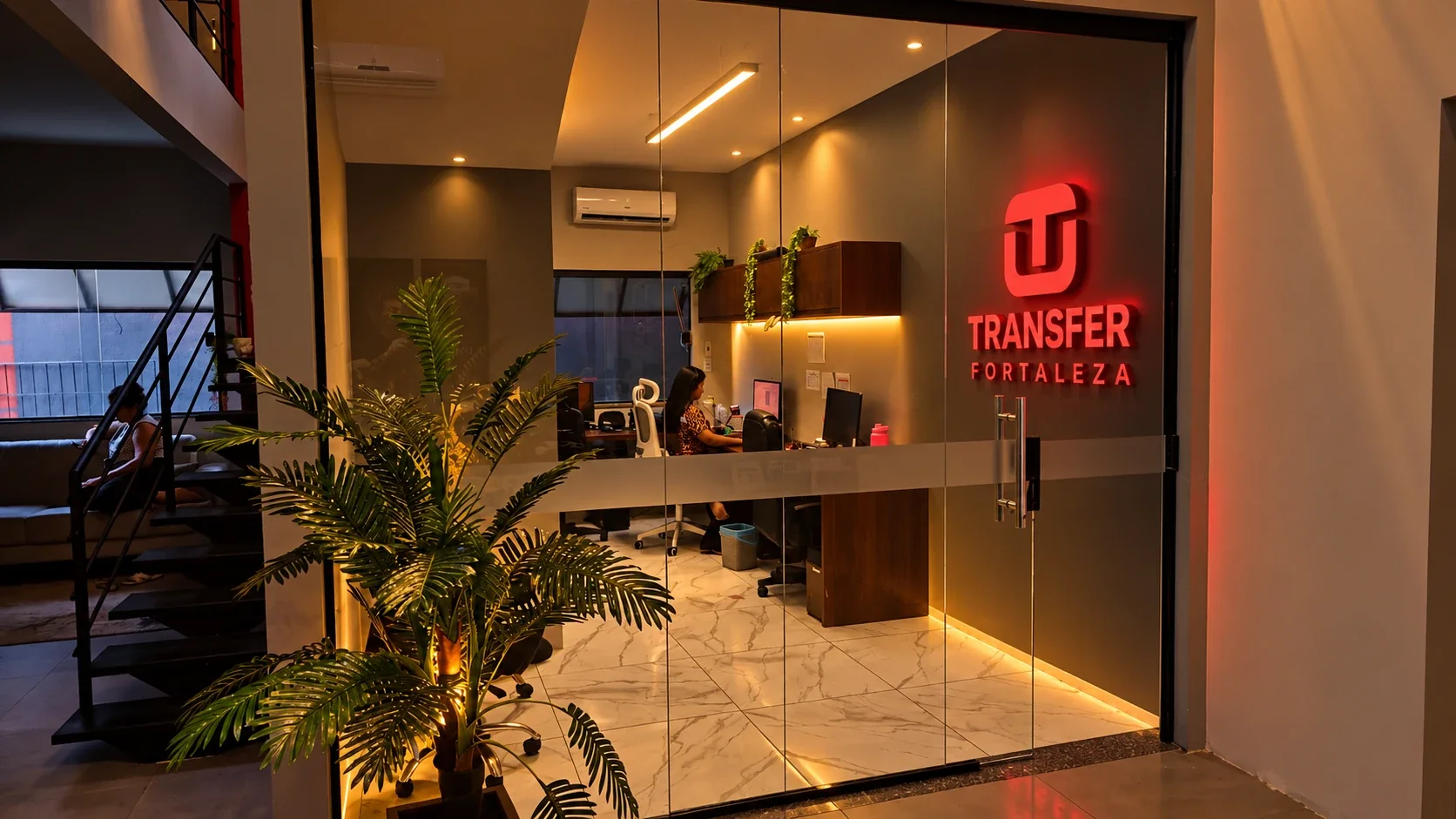 Sala de vendas e reservas com a logo Transfer Fortaleza